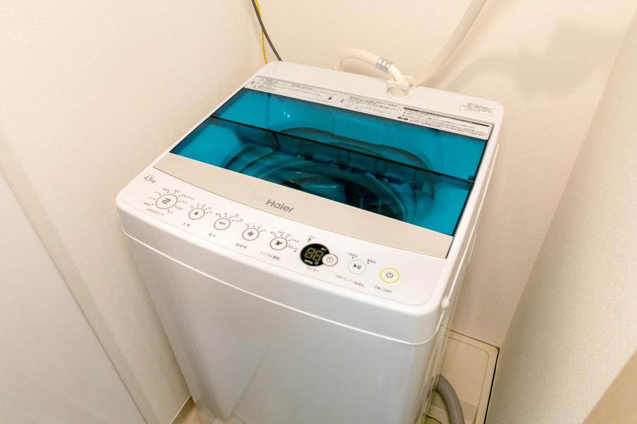 洗濯機は室内に設置。目隠し扉付きで未使用時は目立たずスッキリ